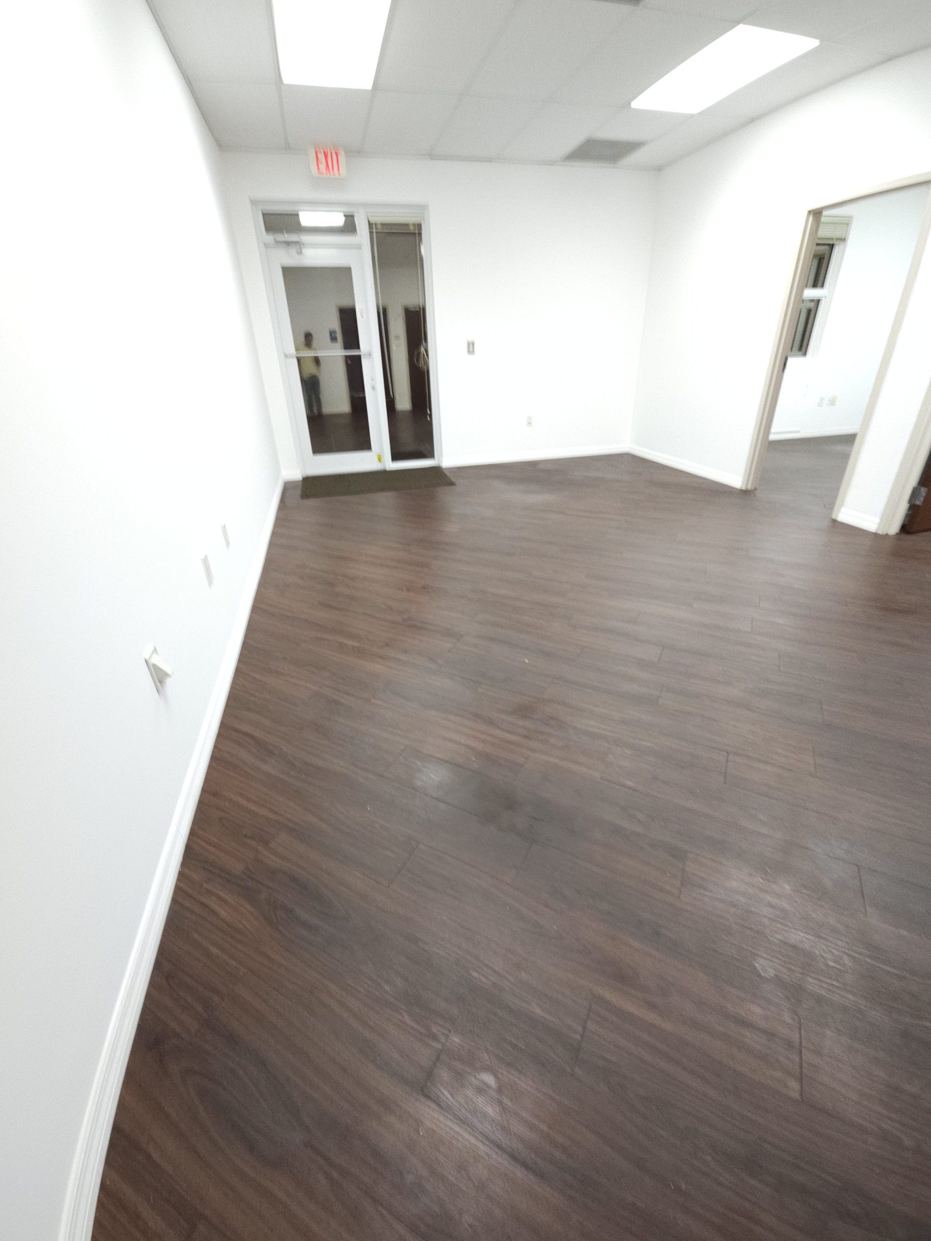 Freshly cleaned office with dark wood floors